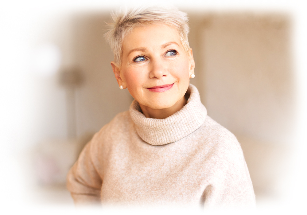 Elegant senior woman with a radiant complexion, embodying graceful aging with Lily & Loaf's Menopause support