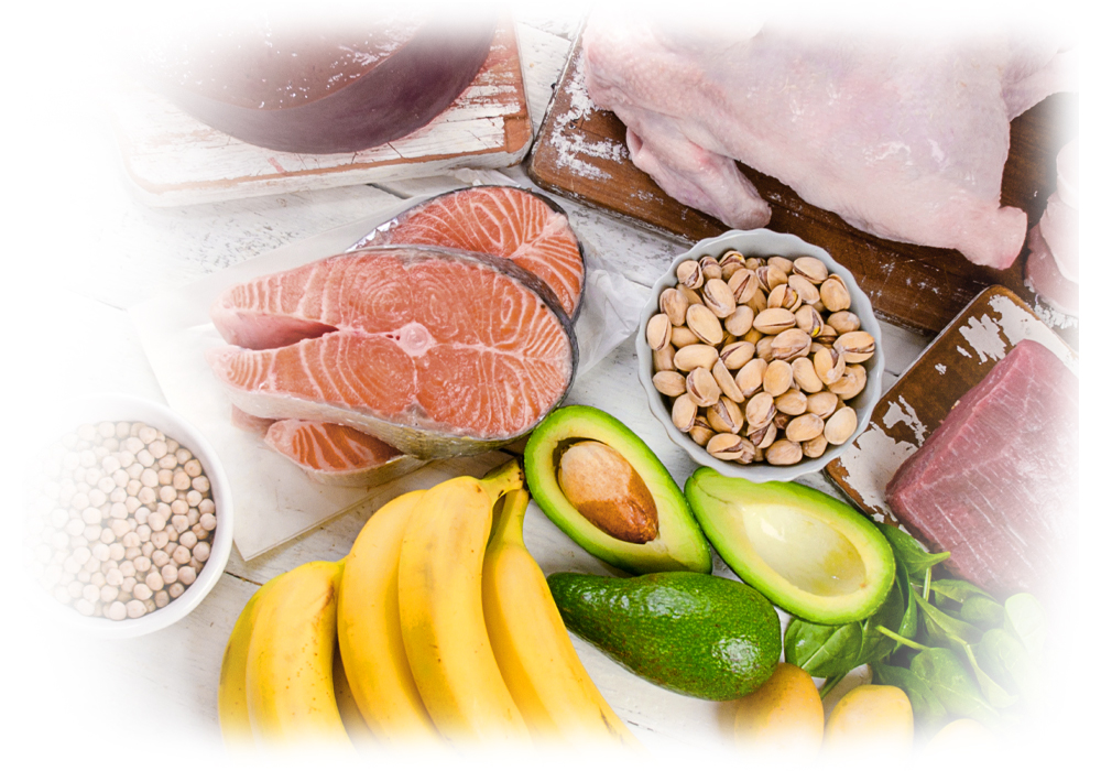 Healthy vitamin B sources: fish, poultry, legumes, with avocados and bananas by Lily & Loaf.