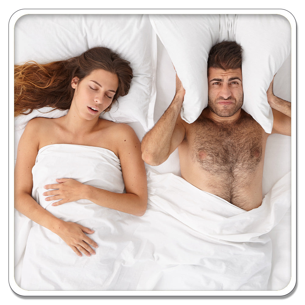 woman and man sleeping in bed