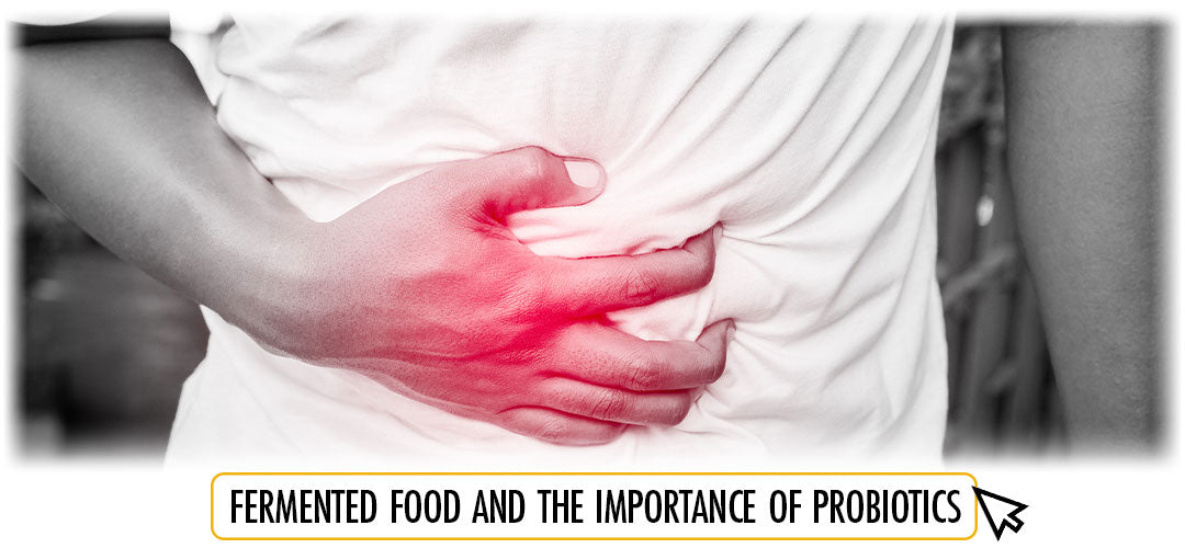 Person clutching stomach, highlighting probiotics and fermented food benefits.