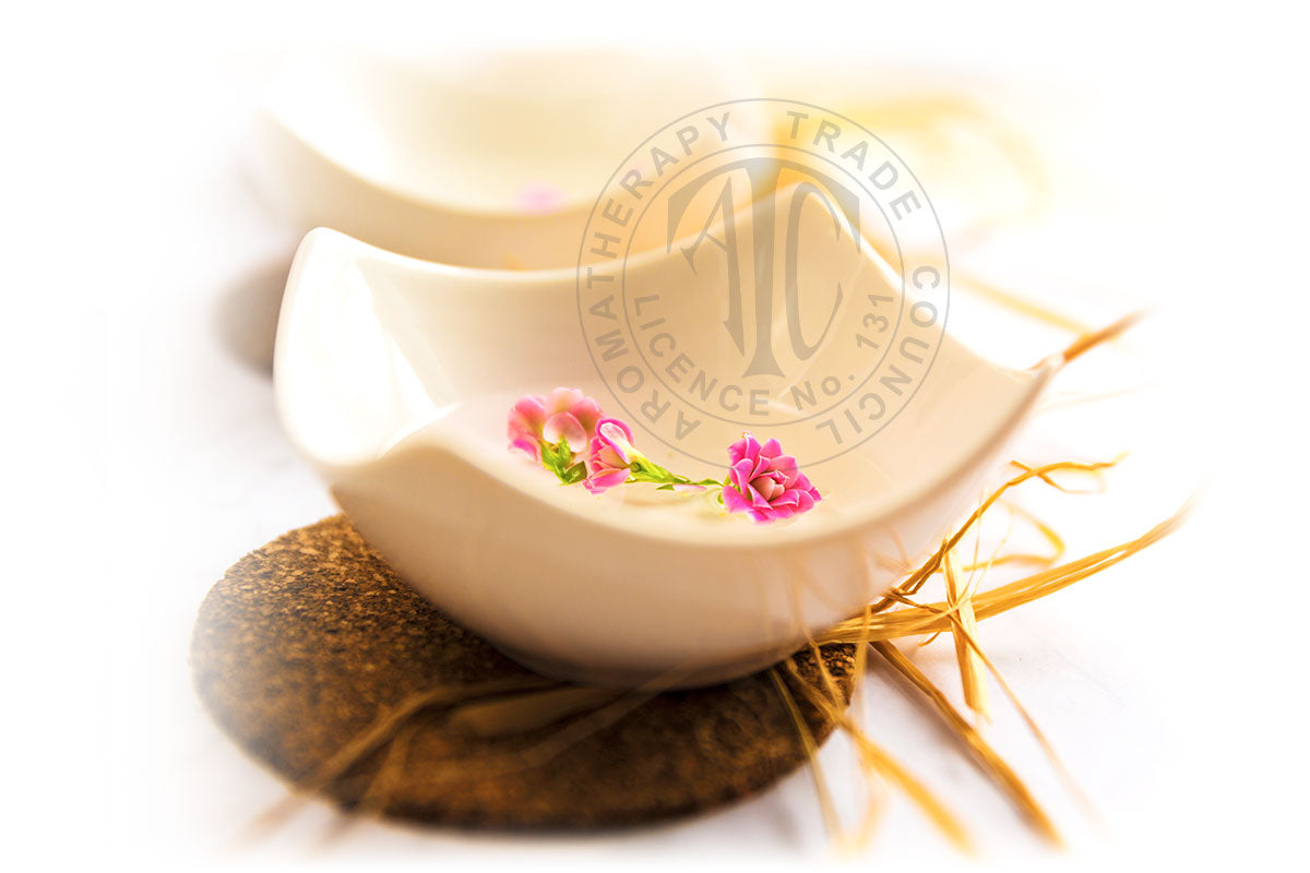 Aromatherapy bowls with delicate flowers, reflecting Lily & Loaf's holistic health ethos.