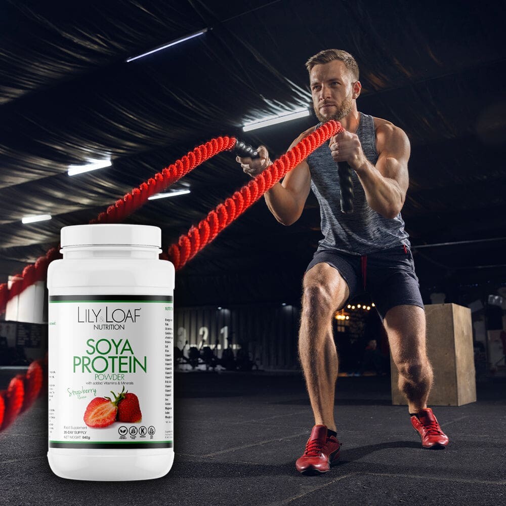 An action-packed image showcasing a fit man engaged in an intense workout with battle ropes, paired with a container of Lily & Loaf Soya Protein Powder, suggesting the product's role in supporting an active and healthy lifestyle.